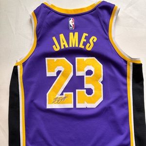 Nike Lebron James Jersey with signature that is stitched on back of jersey.